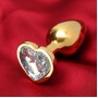 Золотистая анальная пробка с прозрачным кристаллом в форме сердца (Сима-Ленд 5215676)
